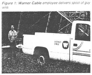 Figure 1: Warner Cable employee delivers spool of guy wire.